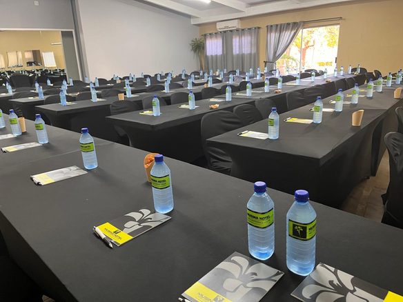 Conference room setup with water bottles